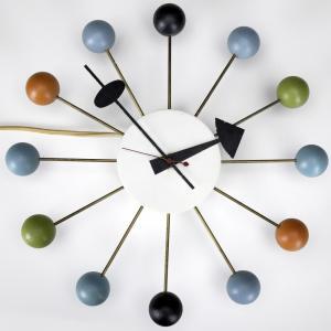 Mid Century Modern Pieces like Irving Harper’s Ball Clock created for the Howard Miller Clock Company as well as Eames Storage Units created for Herman Miller 